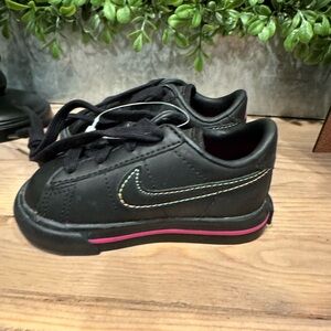 Baby Nikes size 4C. New and never worn!